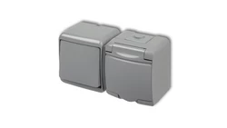 JUNIOR Łącznik jednobiegunowy + gniazdo hermetyczne (klapka popielata) popielaty 10WGHH-1